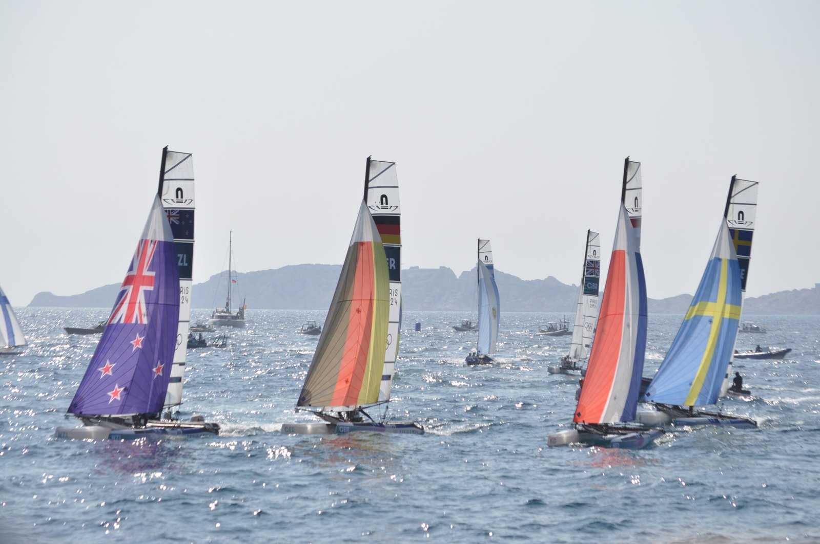 Boats from several countries sailing during the medal race at the 2024 Paris Olympics.