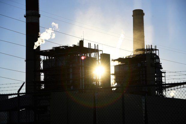 The sun shines between buildings at Xcel Energy's Comanche Generating Station, a 1,410-megawatt coal-fired power plant, on Jan. 7, 2020. (Photo by Andy Cross/The Denver Post)